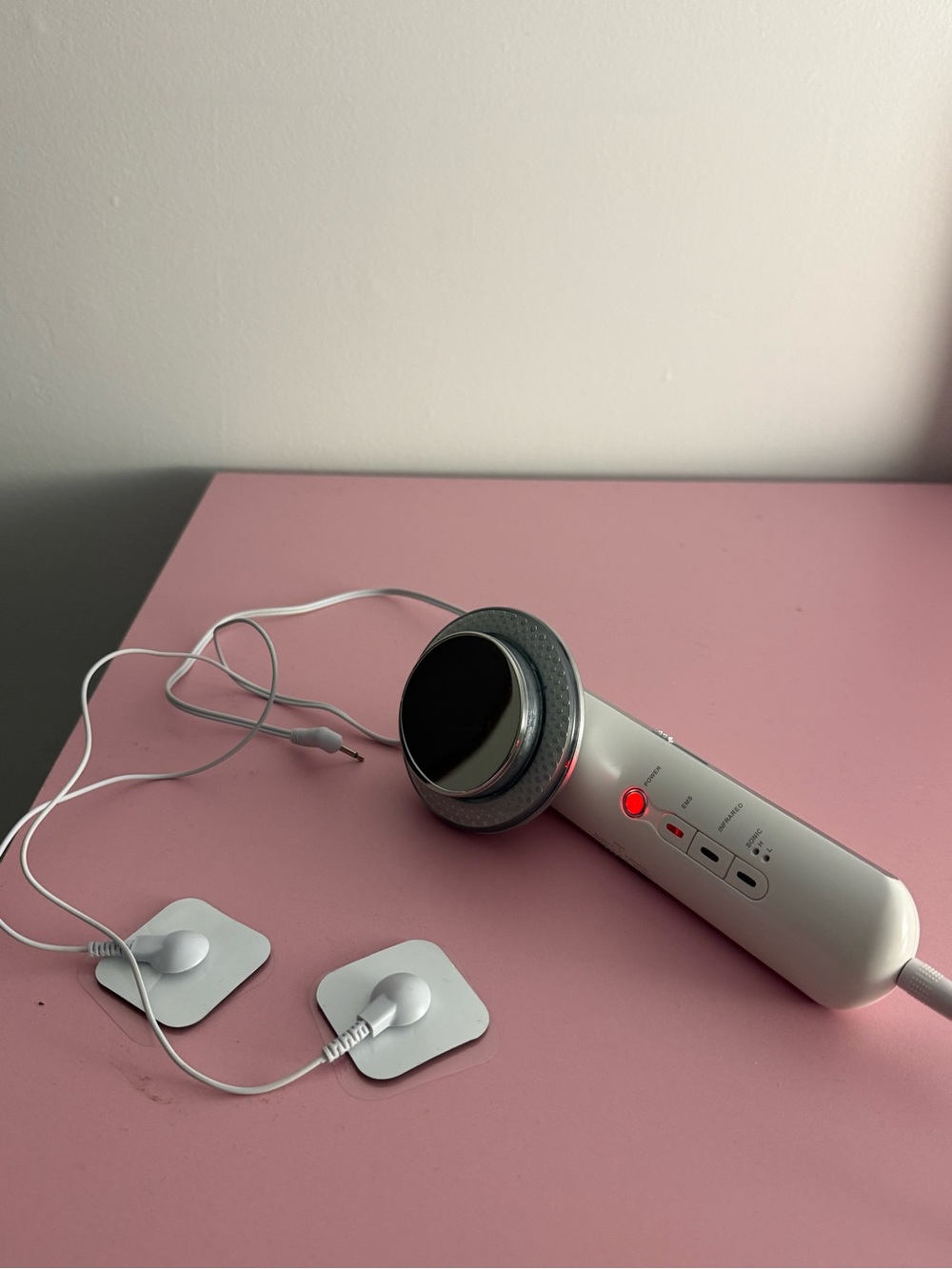 Amazon White and Silver Handheld Beauty Massager with Electrode Pads